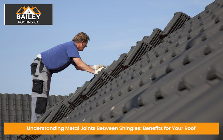 Professional installing metal joints between roof shingles for a secure seal